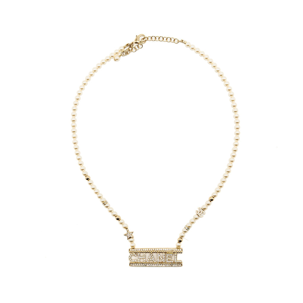 CHANEL LETTER LOGO NECKLACE CRYSTAL/PEARL LIGHT GOLD TONE