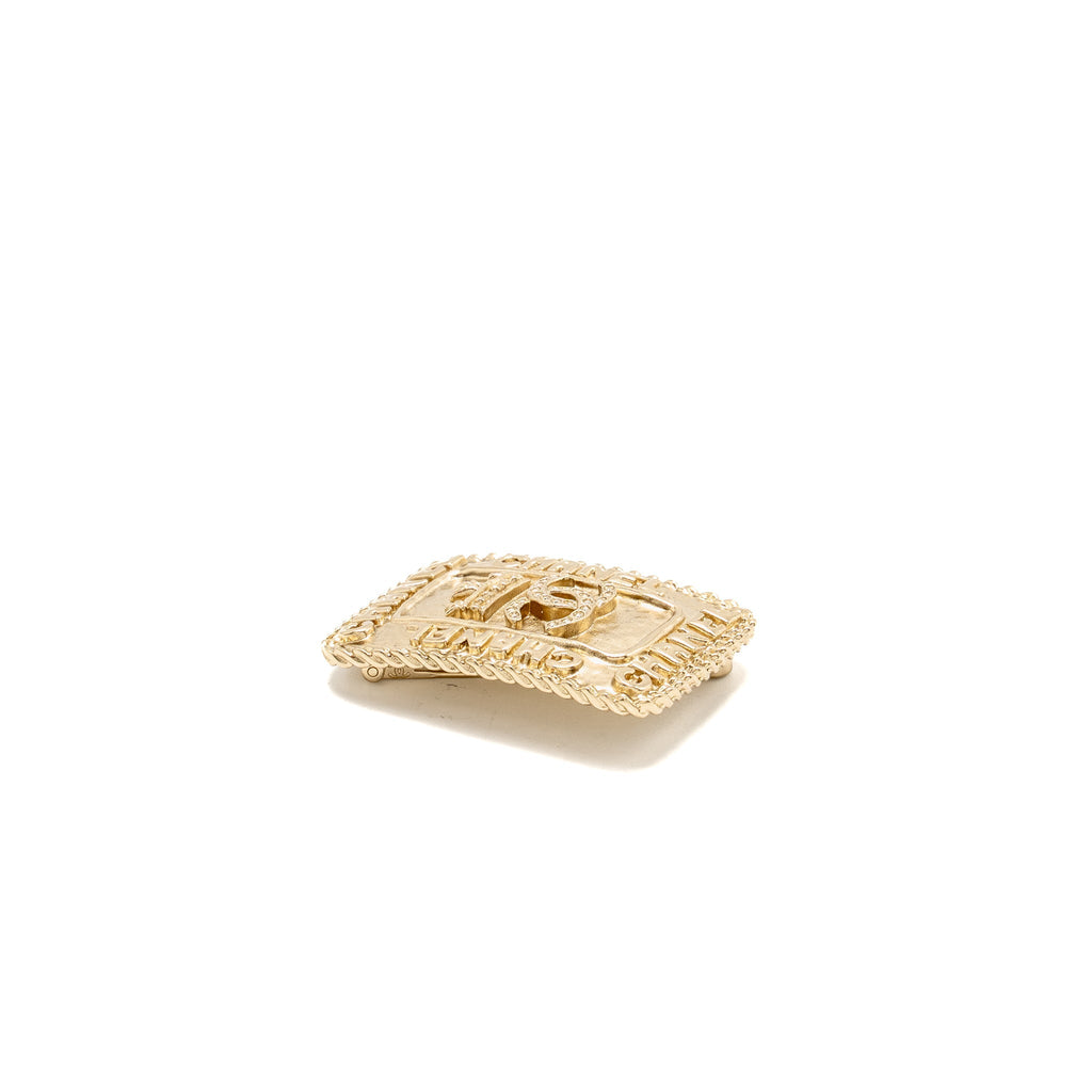 CHANEL CC LOGO AND CROWN METAL PLATE BROOCH BRUSHED GOLD HARDWARE