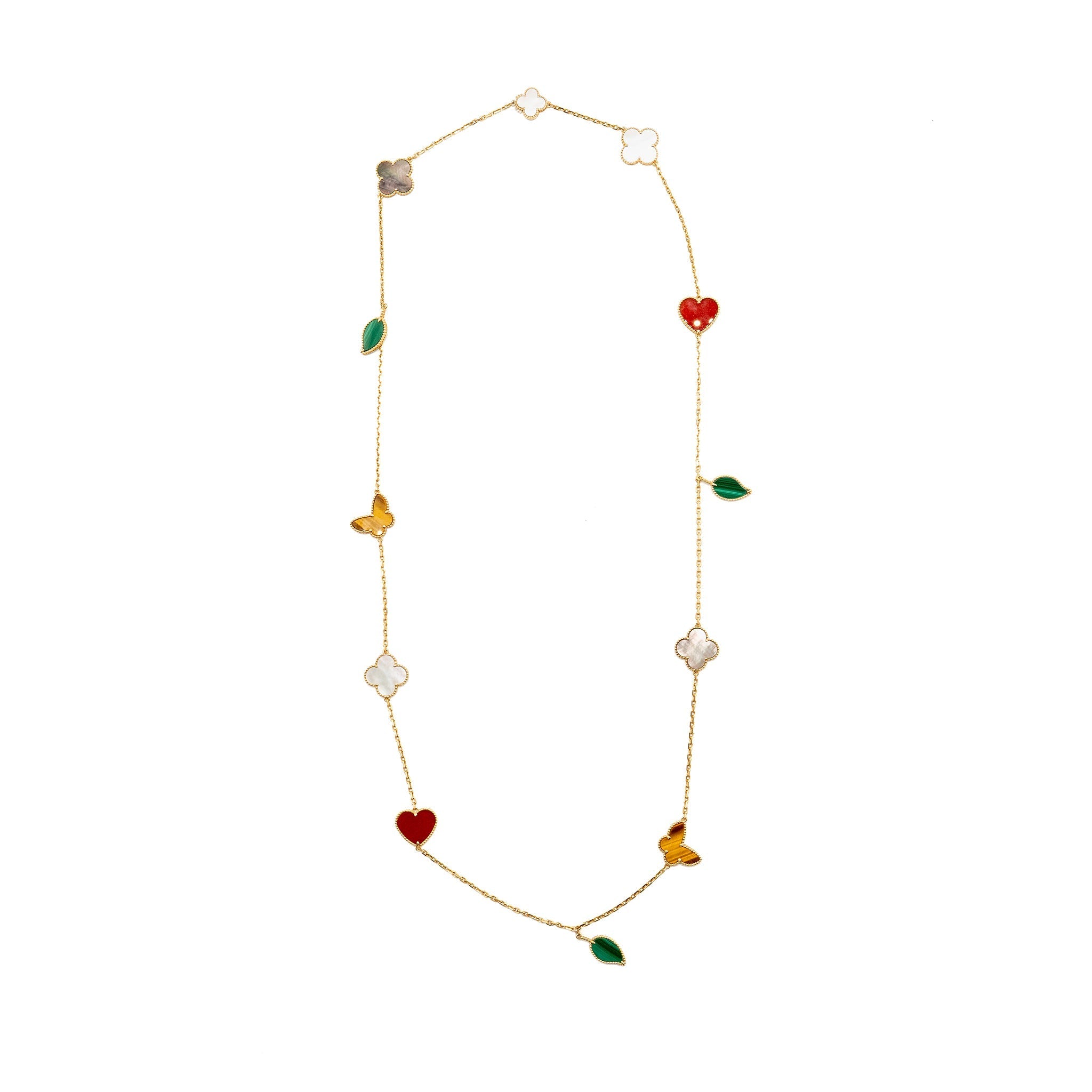 VAN CLEEF & ARPELS LUCKY ALHAMBRA LONG NECKLACE, 12 MOTIFS, YELLOW GOLD, CARNELIAN, MALACHITE, WHITE AND GREY MOTHER-OF-PEARL, TIGER EYE