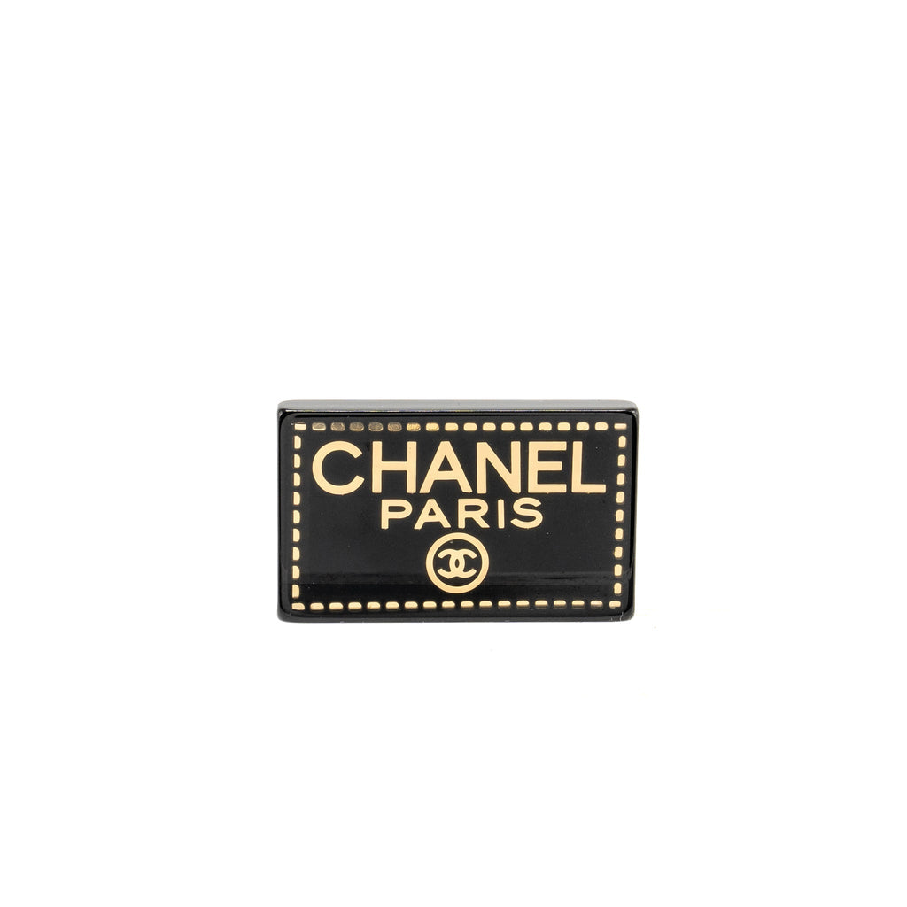 CHANEL RECTANGULAR LOGO BROOCH BLACK GOLD TONE