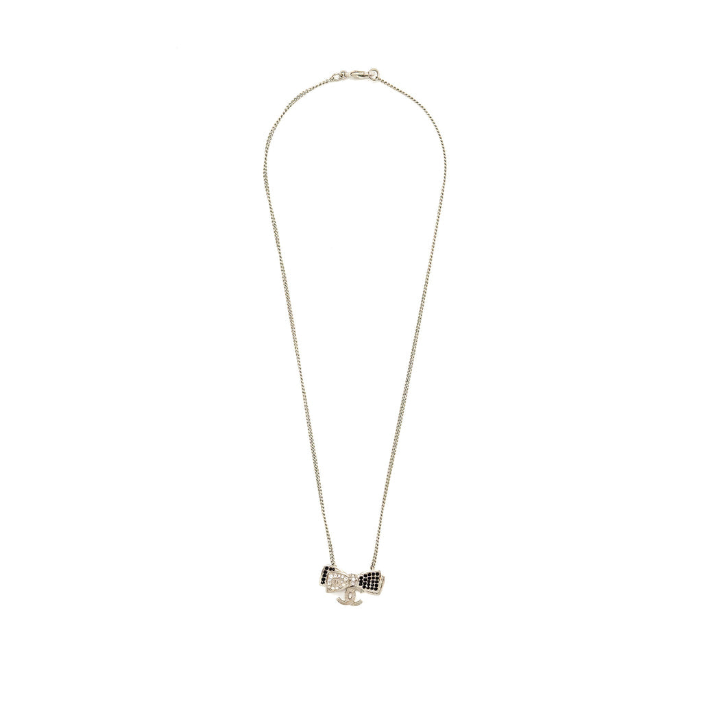 CHANEL BOW/CC LOGO DROP NECKLACE WITH CRYSTAL SILVER TONE