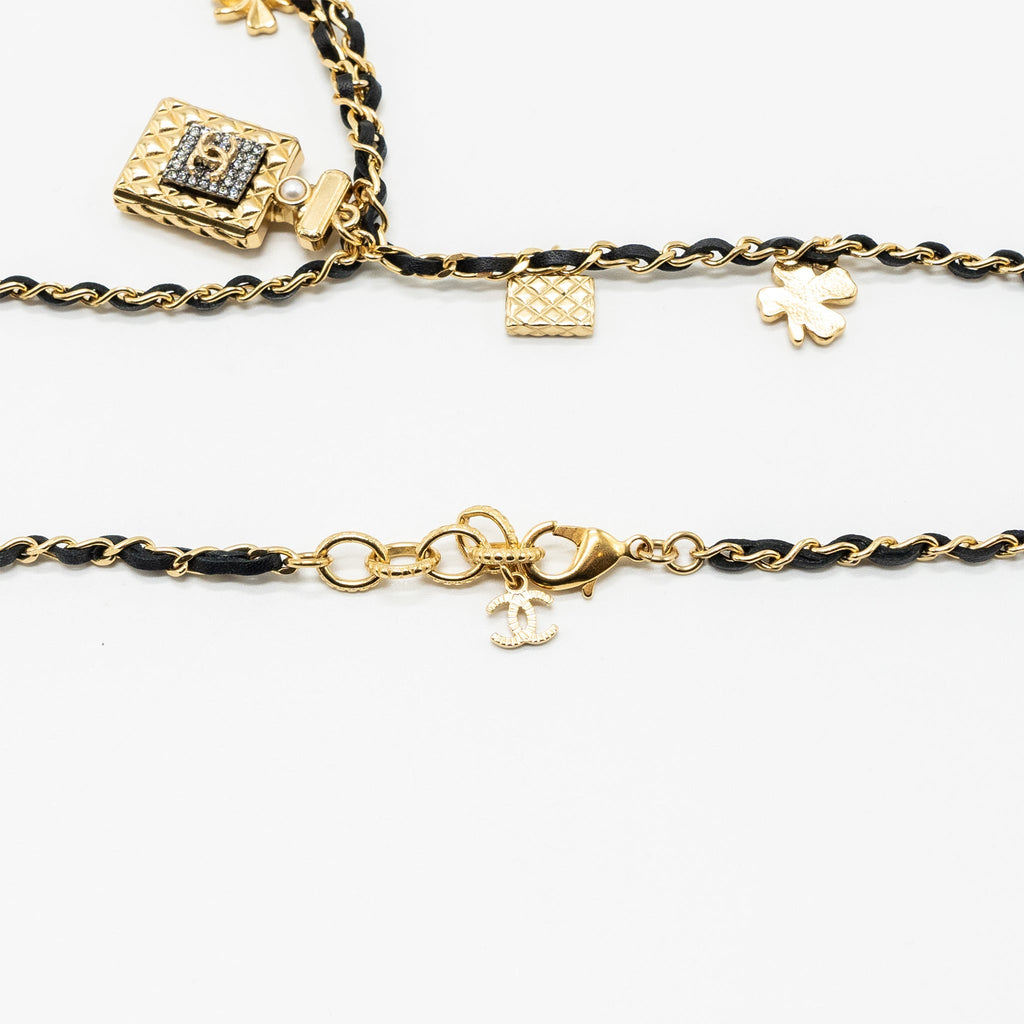 CHANEL PERFUME BOTTLE WITH CHARM BLACK AND GOLD TONE