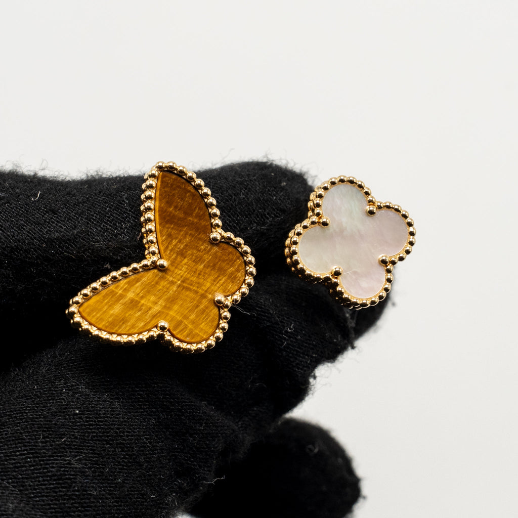 VAN CLEEF & ARPELS LUCKY ALHAMBRA BETWEEN THE FINGER RING, YELLOW GOLD, WHITE MOTHER-OF-PEARL, TIGER’S EYE