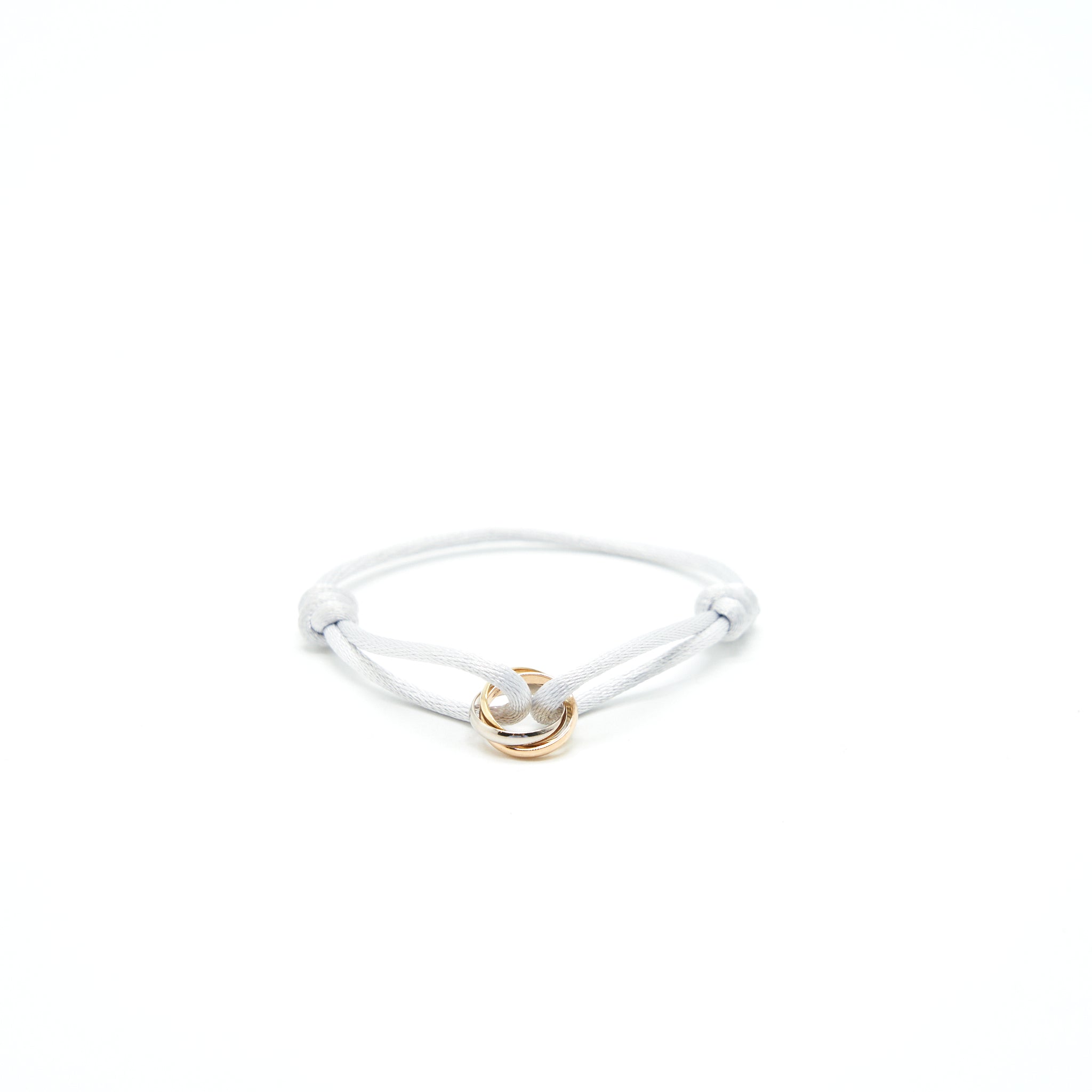 CARTIER TRINITY BRACELET, 3 GOLDS ON CORD