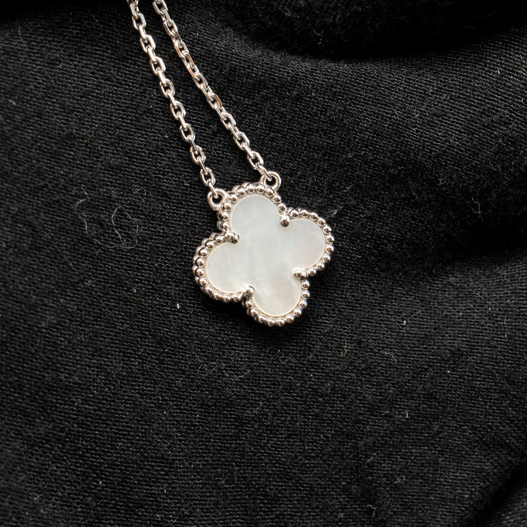 VAN CLEEF & ARPELS VINTAGE ALHAMBRA PENDANT, WHITE GOLD, WHITE MOTHER-OF-PEARL