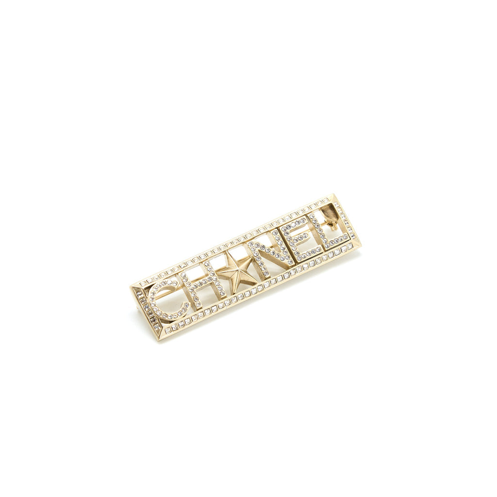 CHANEL LETTER/STAR BROOCH CRYSTAL LIGHT GOLD TONE