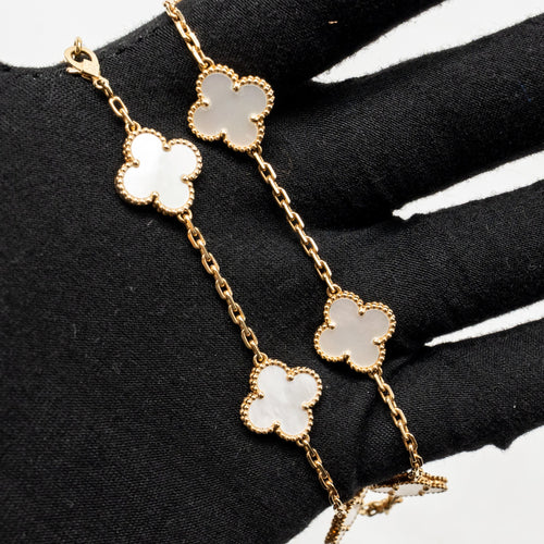 VAN CLEEF & ARPELS VINTAGE ALHAMBRA 10-MOTIF NECKLACE, YELLOW GOLD, WHITE MOTHER-OF-PEARL