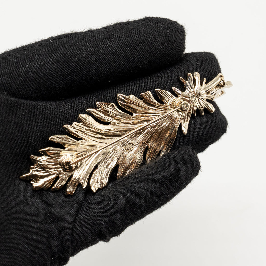 CHANEL CC FEATHER BROOCH AND EARRINGS CRYSTAL GOLD TONE (SELL IN SET)