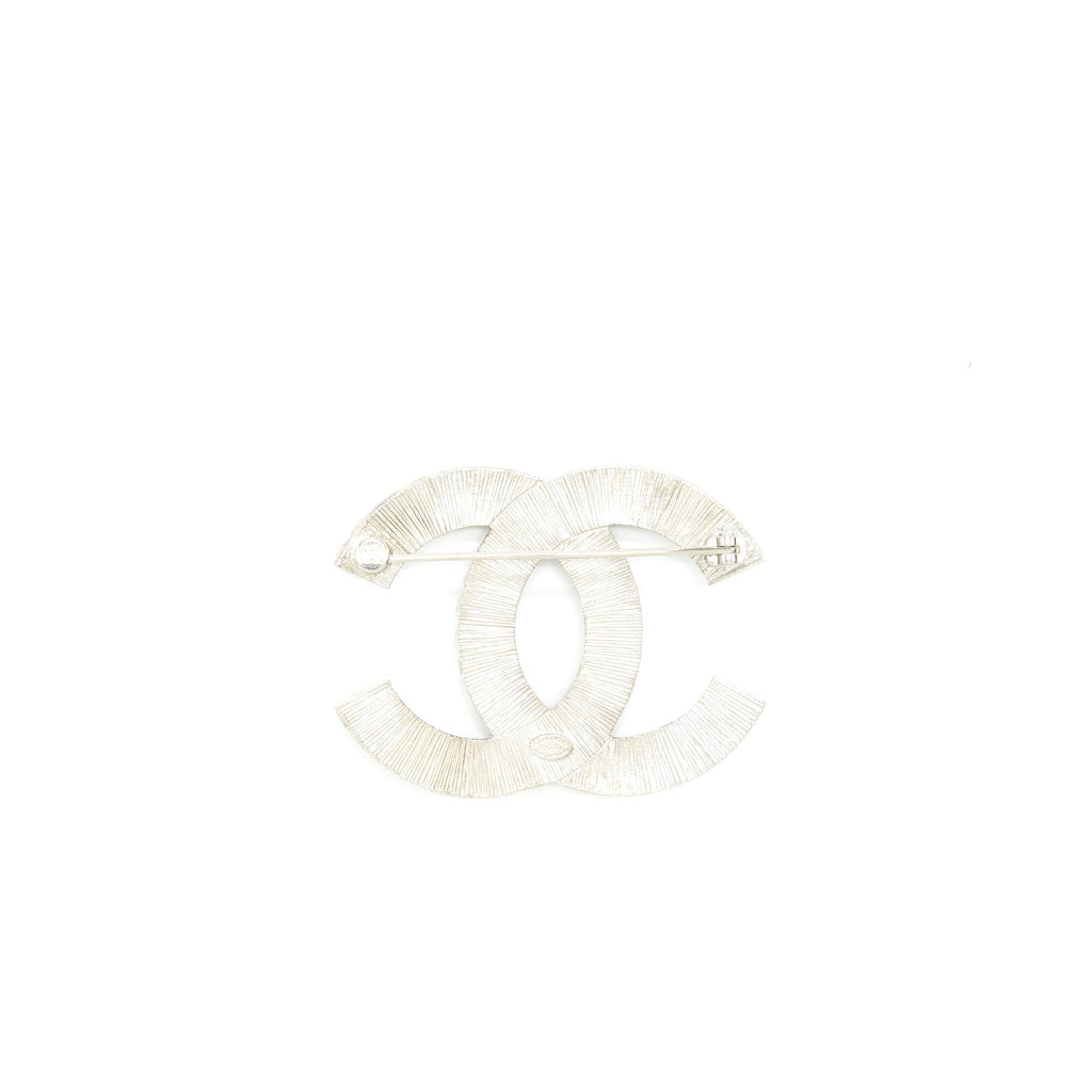 CHANEL METAL AND STRASS BROOCH SILVER TONE