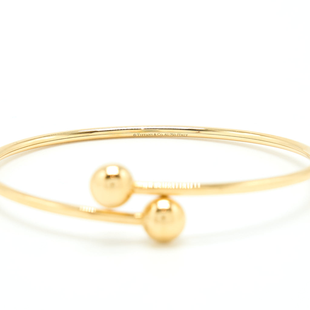 TIFFANY BALL BYPASS BRACELET YELLOW GOLD