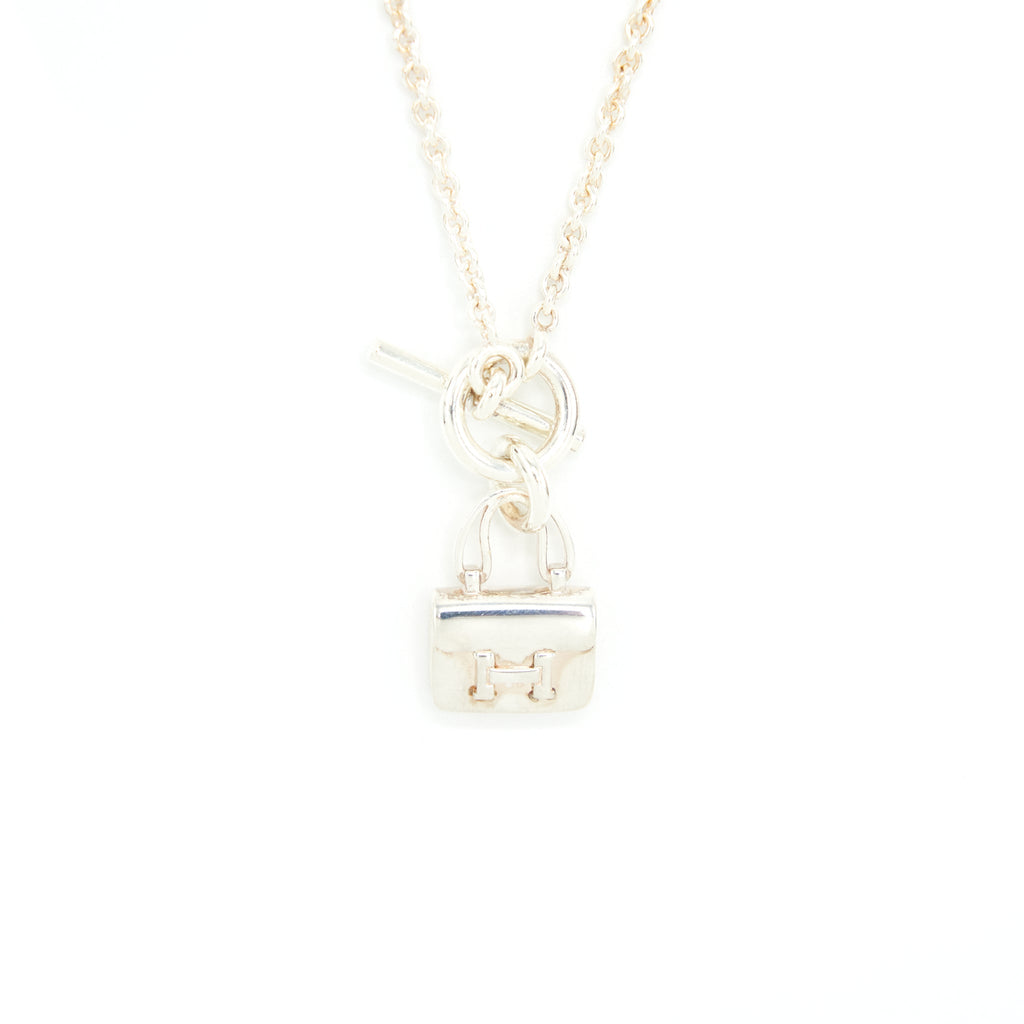 HERMES AMULETTES CONSTANCE PENDANT STERLING SILVER WITH TOGGLE CLOSURE