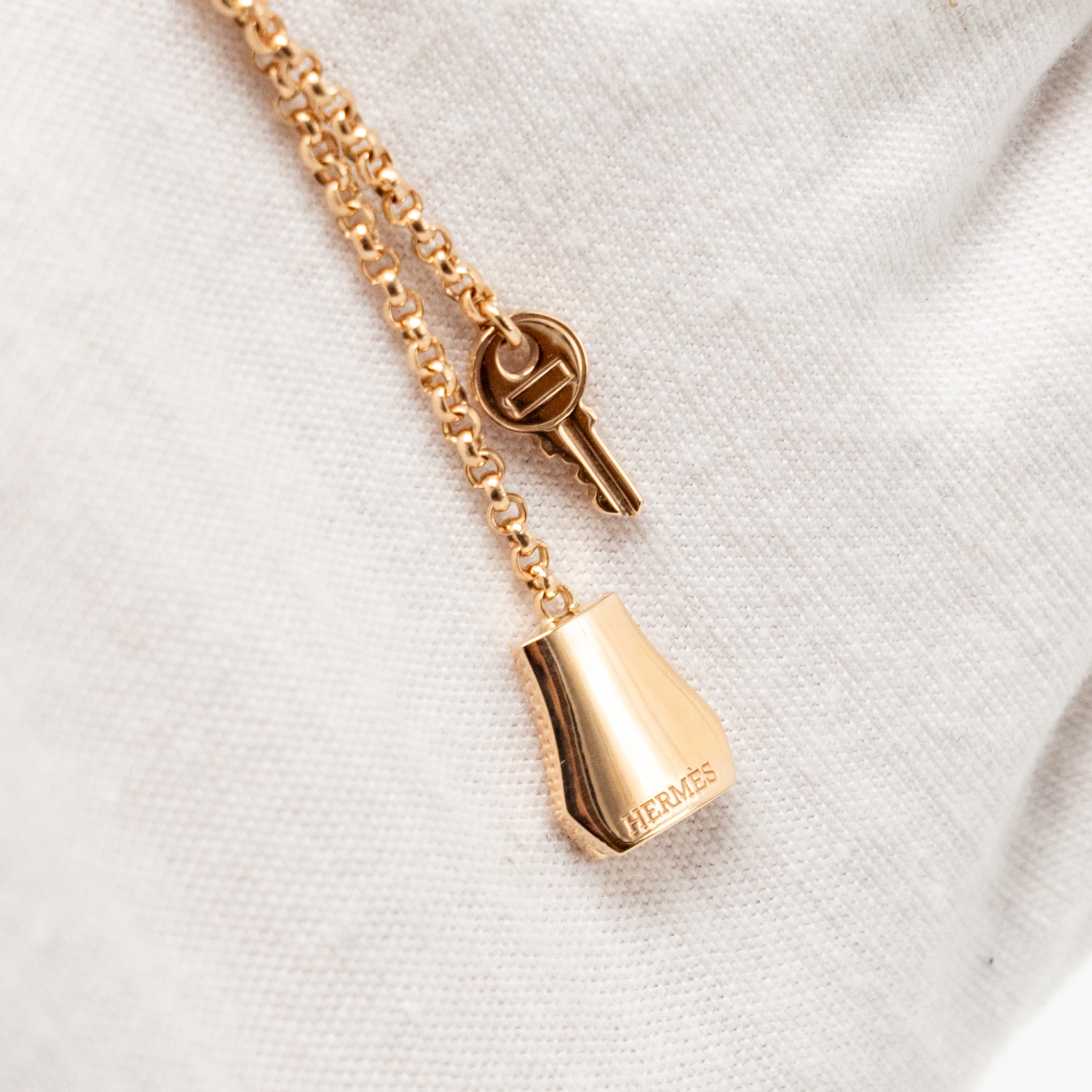 HERMES KELLY CLOCHETTE NECKLACE, SMALL GOLD ROSE GOLD