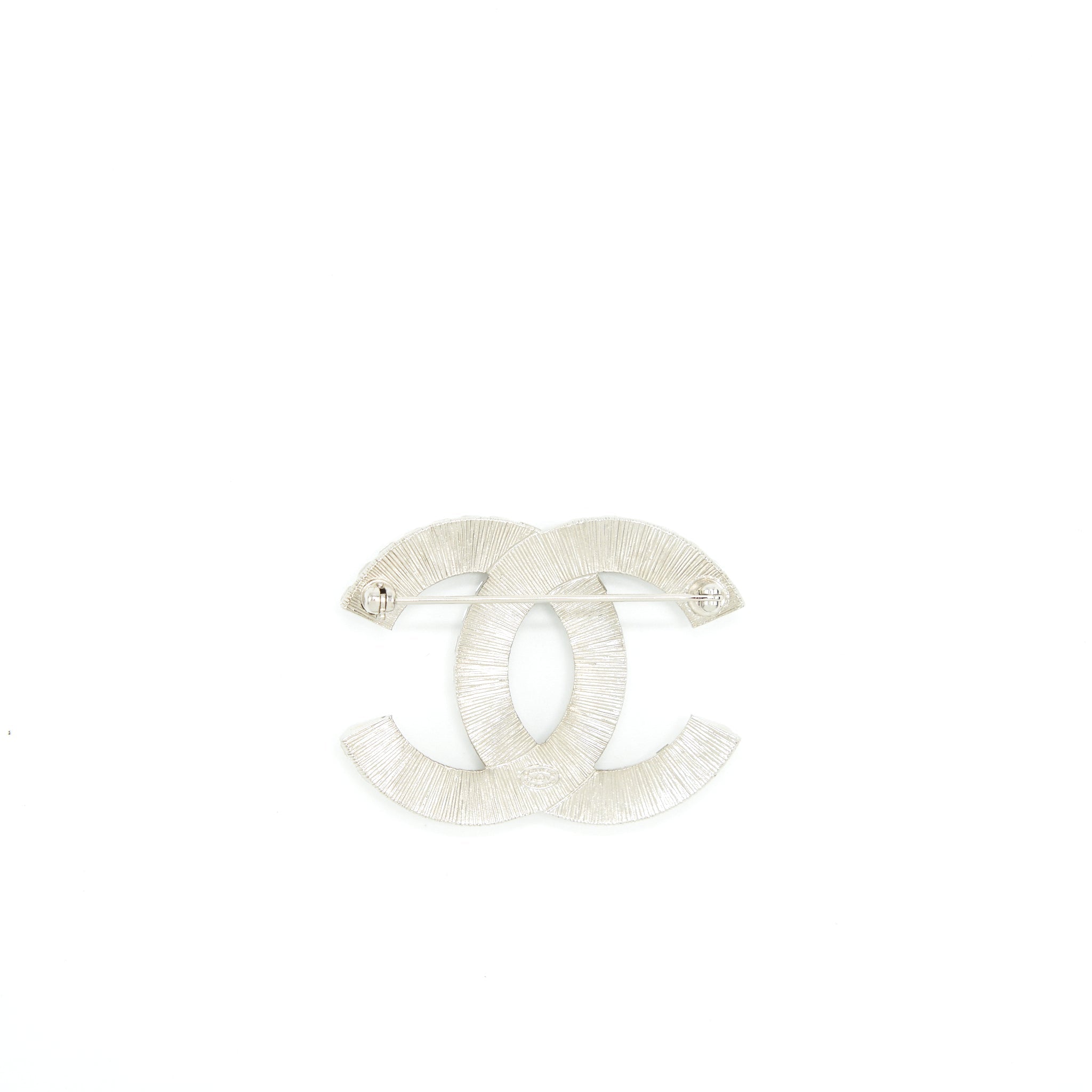 CHANEL METAL AND STRASS BROOCH SILVER TONE
