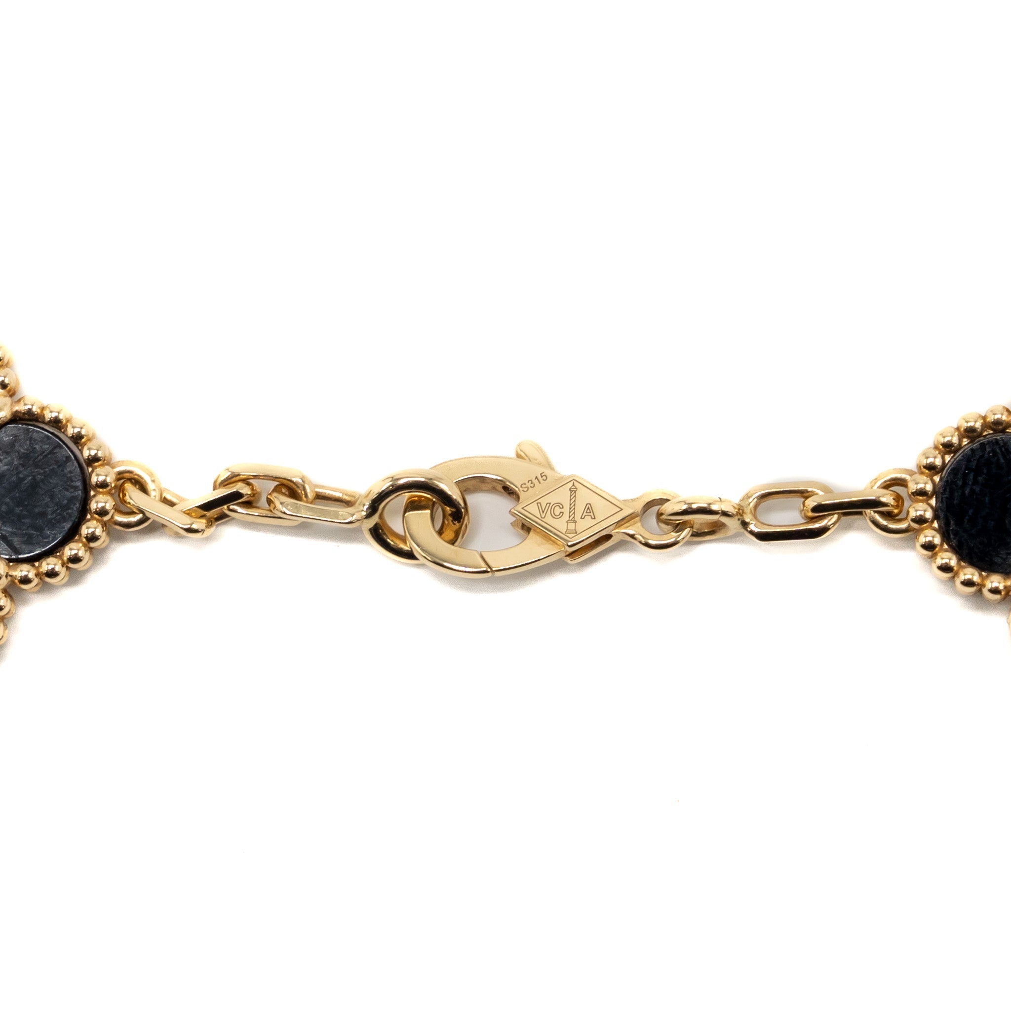 VAN CLEEF & ARPELS VINTAGE ALHAMBRA 10-MOTIF PENDANT ONYX YELLOW GOLD