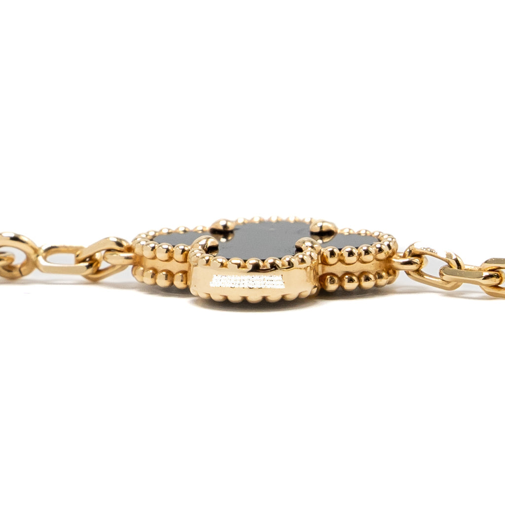 VAN CLEEF & ARPELS VINTAGE ALHAMBRA 10-MOTIF PENDANT ONYX YELLOW GOLD