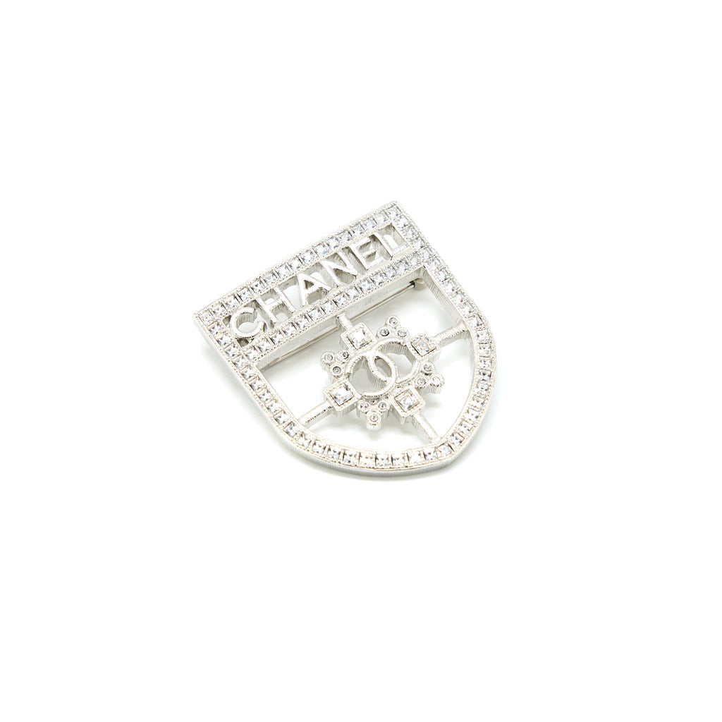 CHANEL SHIELD BROOCH CRYSTAL SILVER TONE