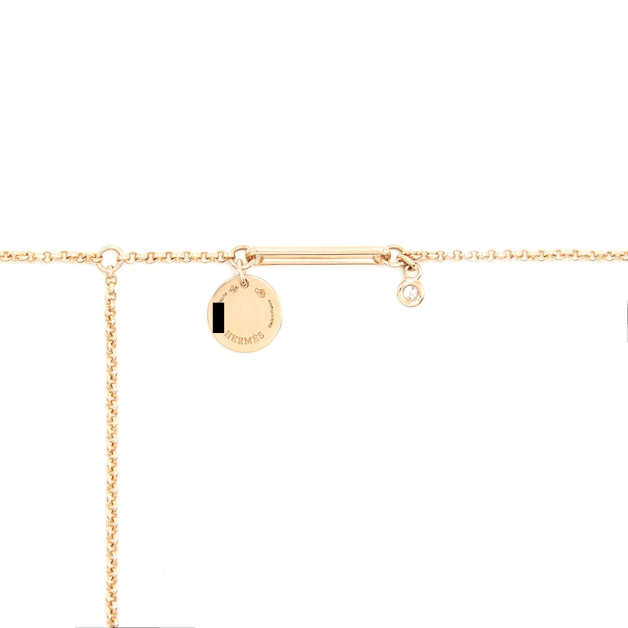 HERMES EX-LIBRIS PENDENT IN ROSE GOLD SET WITH A DIAMOND